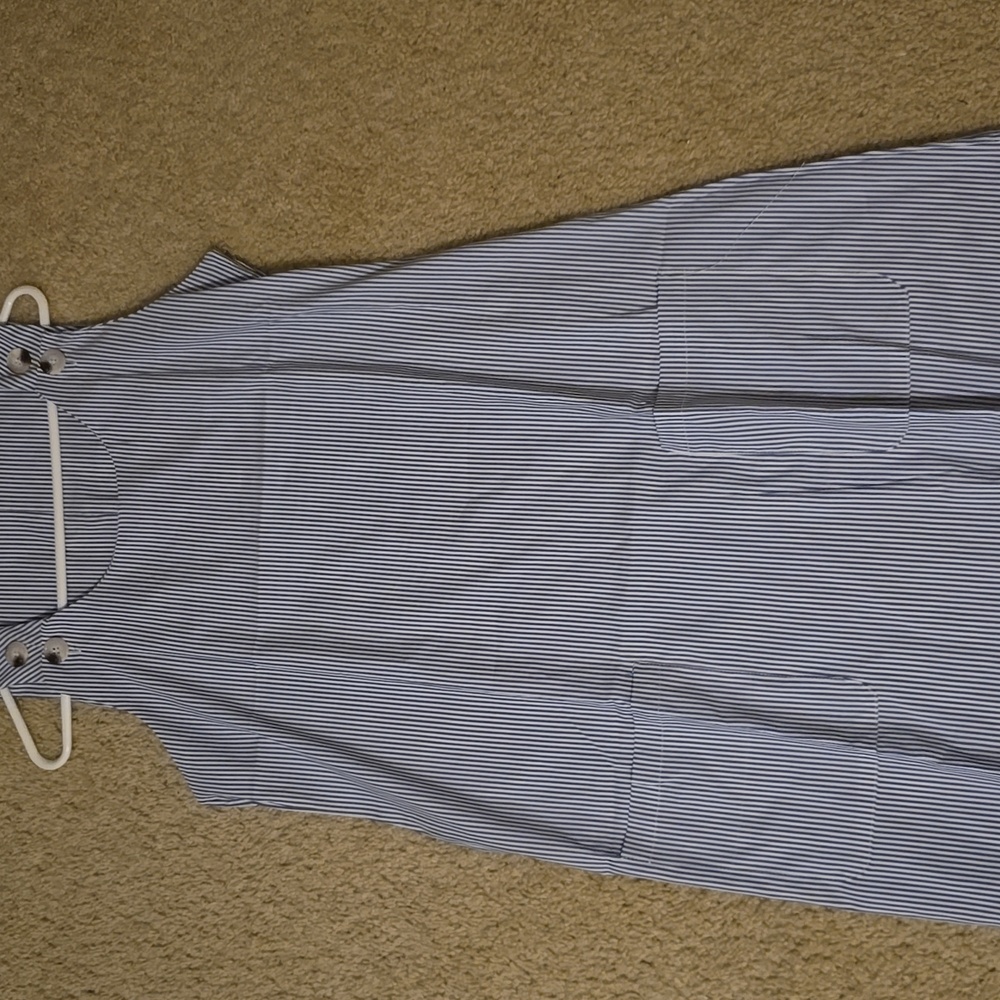 Blue and white stripped polyester and elastane dress size large. Never been worn